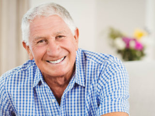 Senior man looking at camera and smiling